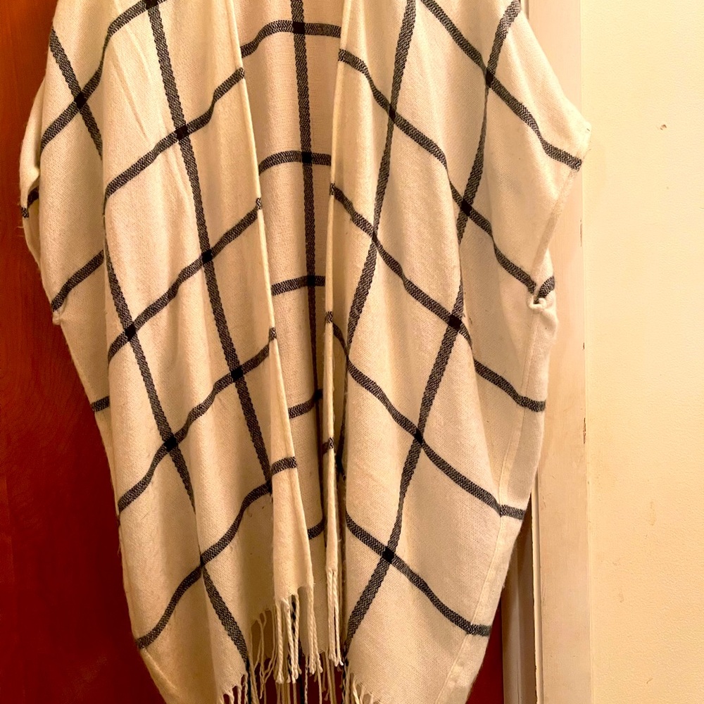 A one size fits all poncho with fringe ends!!